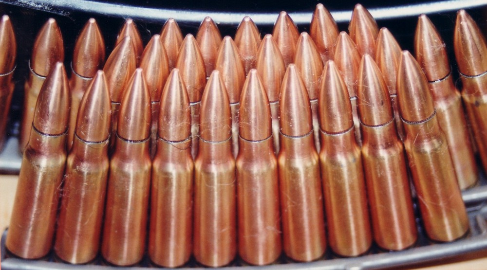 AK 47  7.62mm kalashnikov rounds on strip.JPG