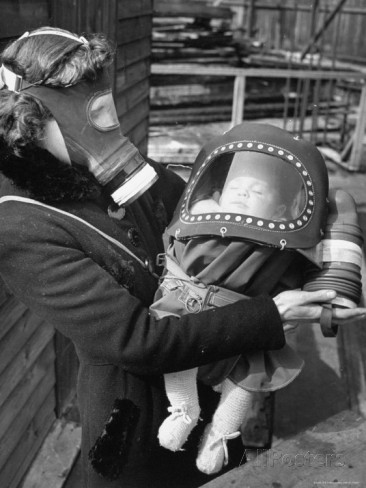 hans-wild-mother-and-baby-wearing-gas-masks-during-gas-preparations-test-during-wwii.jpg
