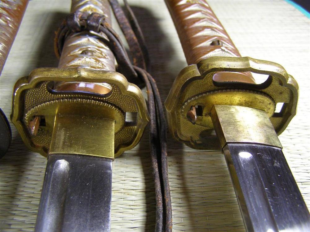 Type 95 Brass Tsuba - Top Latch Variations.JPG